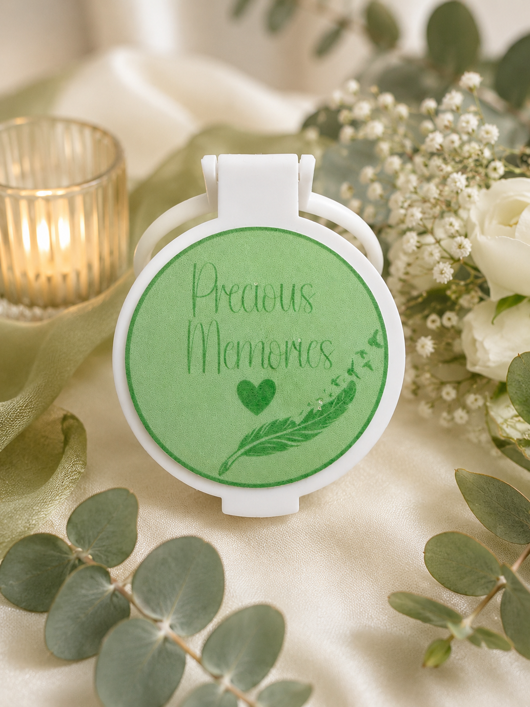 Personalised Precious Memories memorial compact mirror featuring a green design with a heart, delicate feather and botanical details.