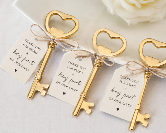 Gold heart key bottle opener wedding favours with thank you for being a key part of our lives gift tags tied with natural twine