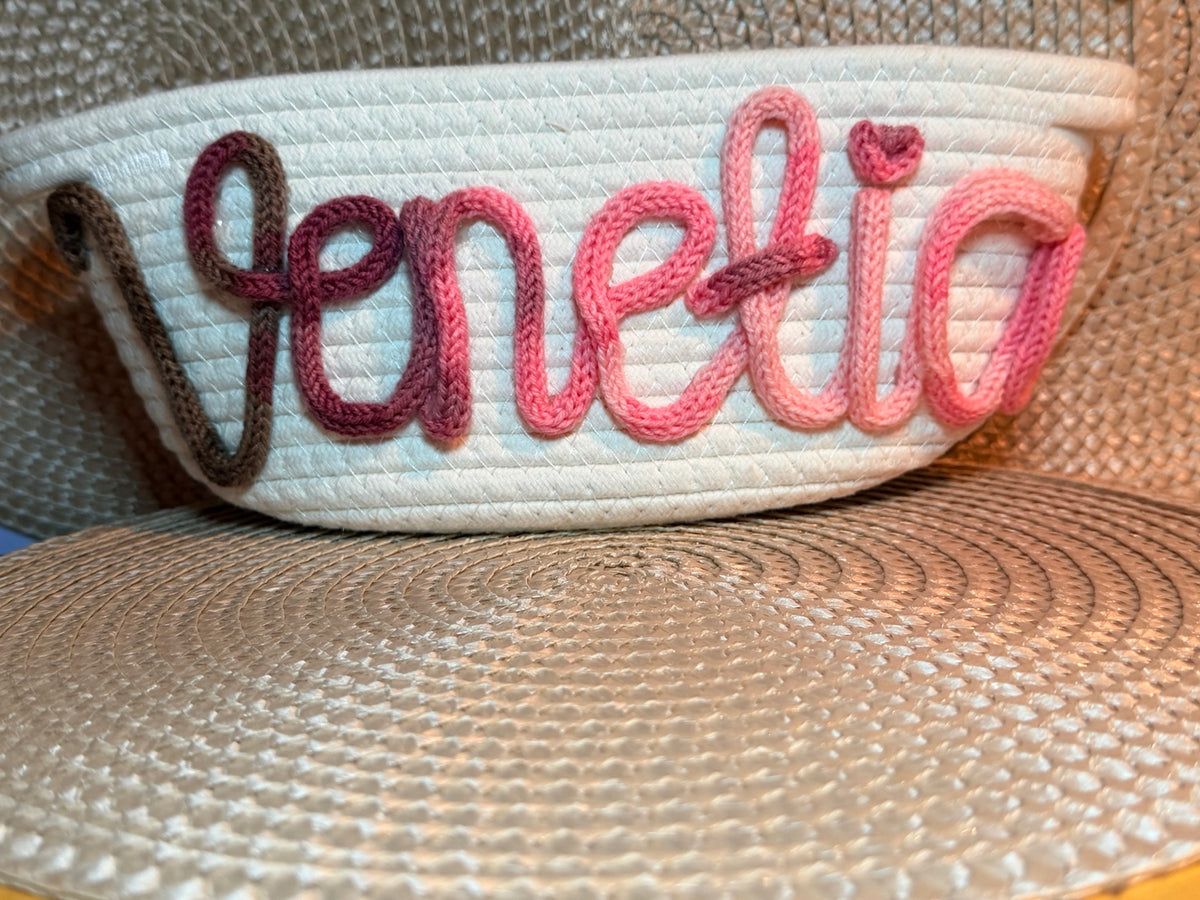 Personalised woven storage basket with a handmade Tricotin name and heart detail